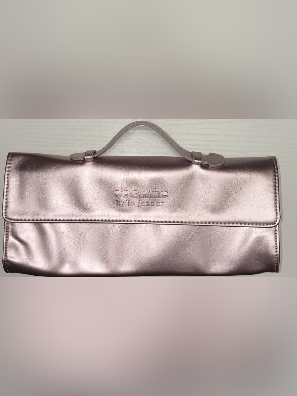 Kylie Cosmetics Cosmic metallic pink clutch bag